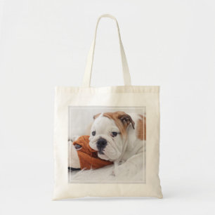 An English Bulldog Puppy Playing With A Bulldog Tote Bag