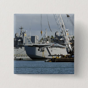 An F-15 Eagle gets a lift from a barge crane Pinback Button