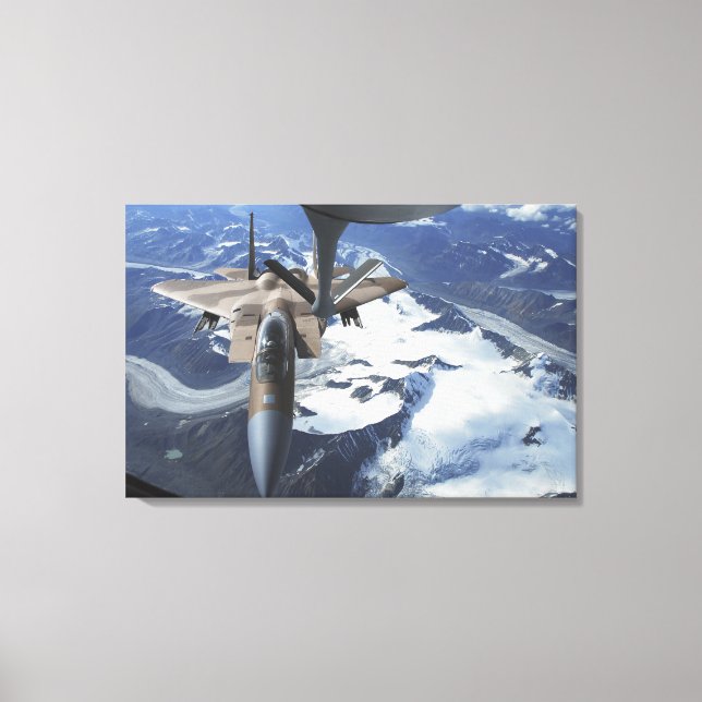 An F-15C Eagle aircraft sits behind a KC-135R Canvas Print (Front)