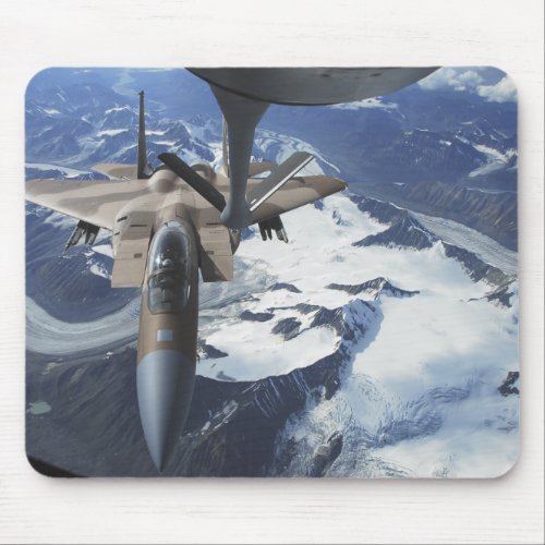 An F_15C Eagle aircraft sits behind a KC_135R Mouse Pad