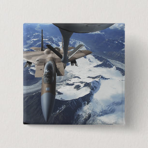 An F-15C Eagle aircraft sits behind a KC-135R Pinback Button