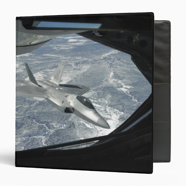 An F-22 Raptor banks away from a KC-135 Binder (Front/Inside)