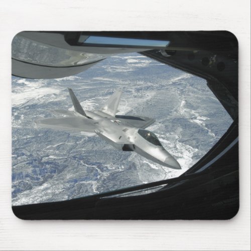 An F_22 Raptor banks away from a KC_135 Mouse Pad