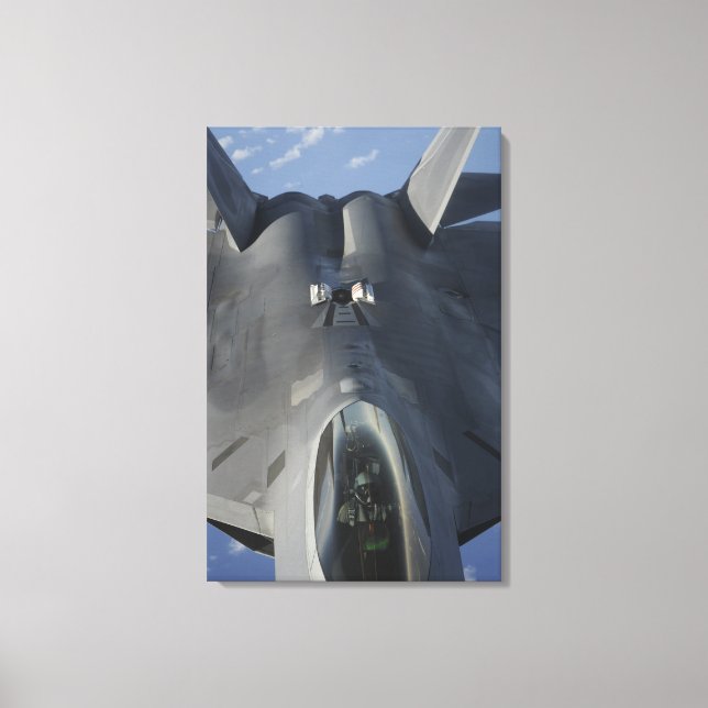 An F-22 Raptor moves into position to receive f Canvas Print (Front)