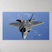 An F-22 Raptor moves into position to receive f