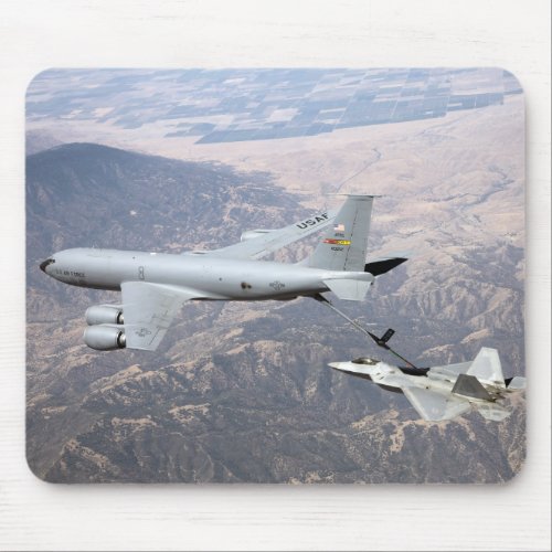 An F_22 Raptor receives fuel from a KC_135 Mouse Pad