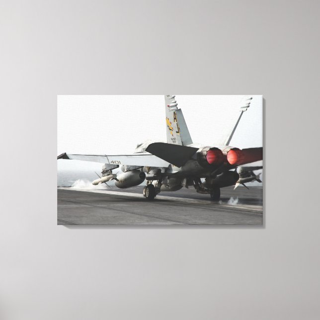 An F/A-18C Hornet launches from the flight deck 2 Canvas Print (Front)