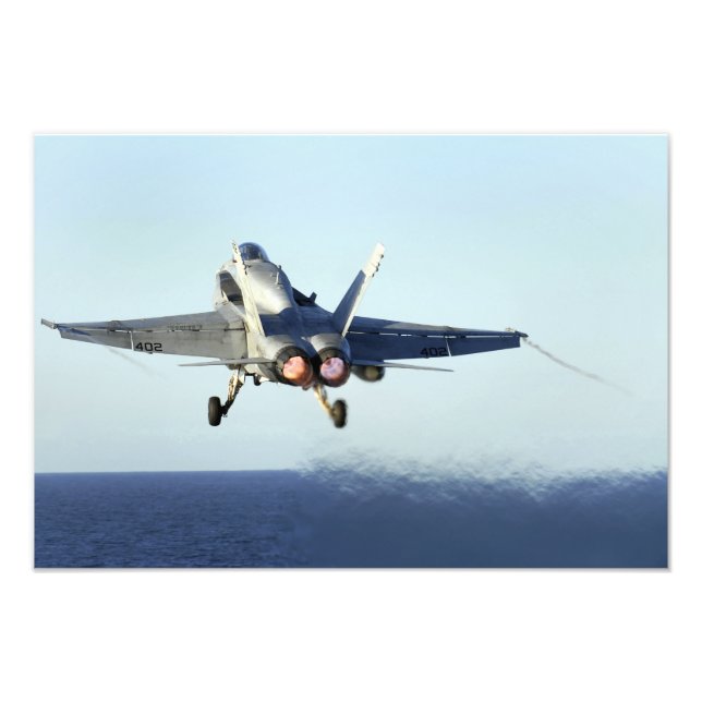 An F/A-18C Hornet launches from the flight deck 2 Photo Print (Front)