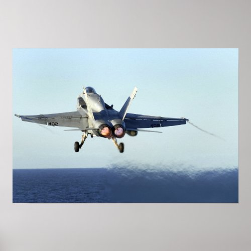 An FA_18C Hornet launches from the flight deck 2 Poster