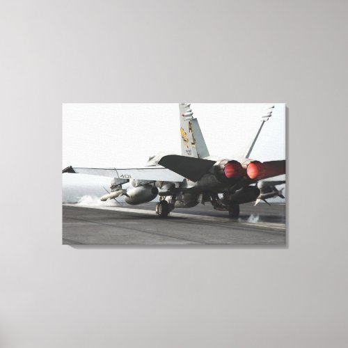 An FA_18C Hornet launches from the flight deck Canvas Print