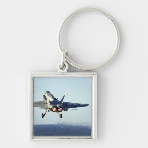 An FA_18C Hornet launches from the flight deck Keychain