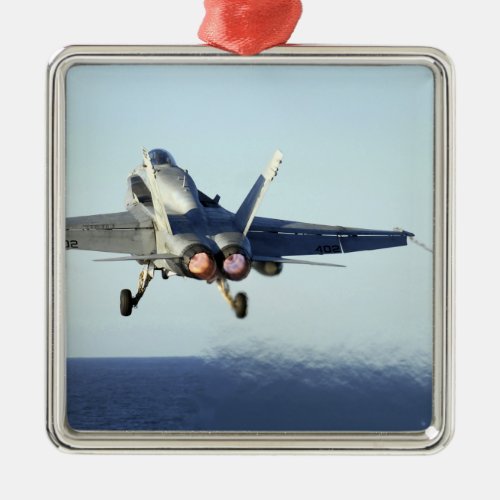 An FA_18C Hornet launches from the flight deck Metal Ornament