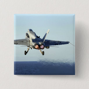 An F/A-18C Hornet launches from the flight deck Pinback Button