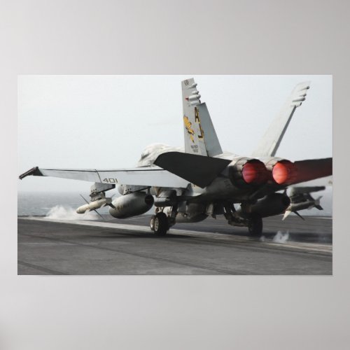 An FA_18C Hornet launches from the flight deck Poster