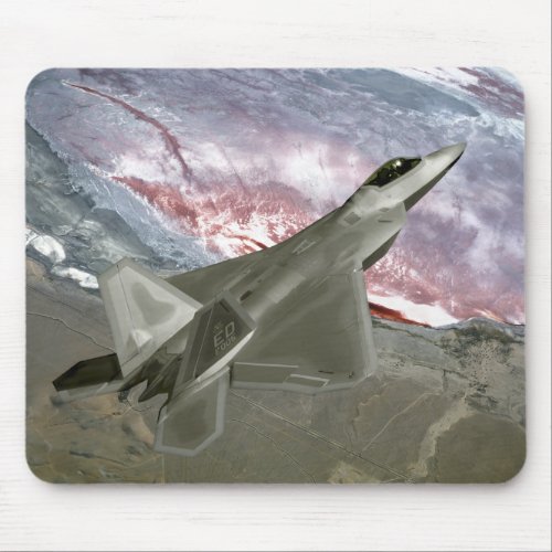 An FA_22 Raptor flies a training mission Mouse Pad