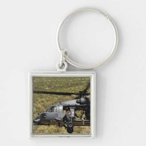 An HH_60 Pave Hawk flies over the desert Keychain