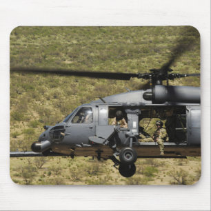 An HH-60 Pave Hawk flies over the desert Mouse Pad