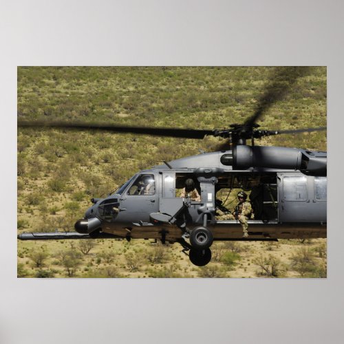 An HH_60 Pave Hawk flies over the desert Poster