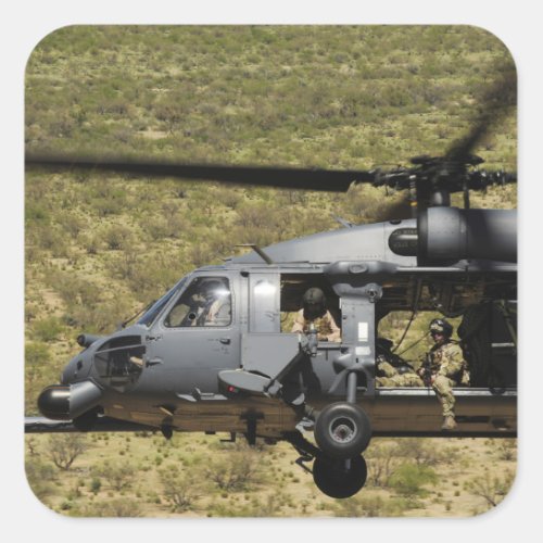 An HH_60 Pave Hawk flies over the desert Square Sticker