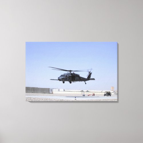 An HH_60G Pave Hawk taking off from Camp Bastio Canvas Print