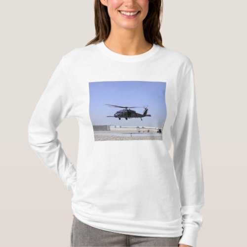 An HH_60G Pave Hawk taking off from Camp Bastio T_Shirt