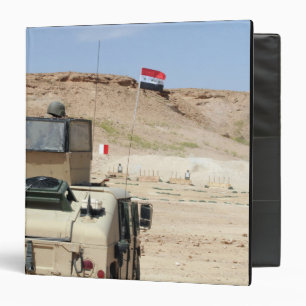 An instructor watches as an Iraqi army soldier 3 Ring Binder