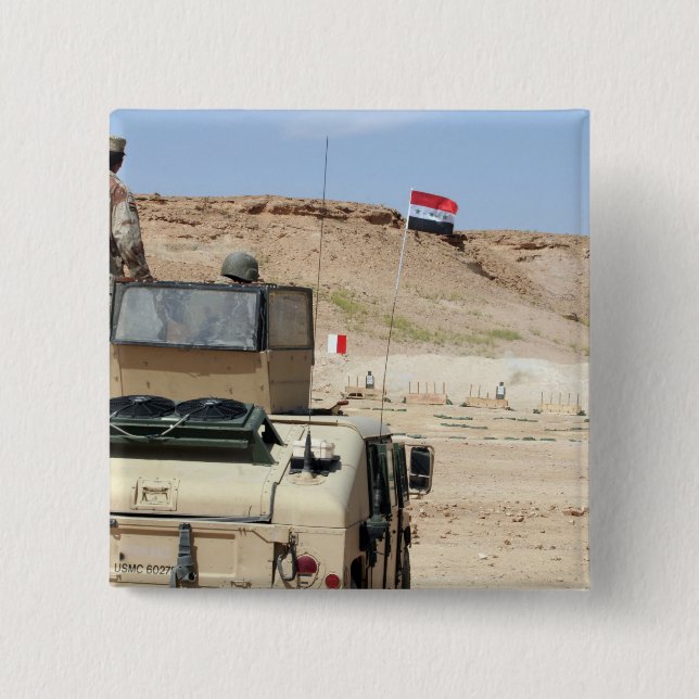 An instructor watches as an Iraqi army soldier Pinback Button (Front)