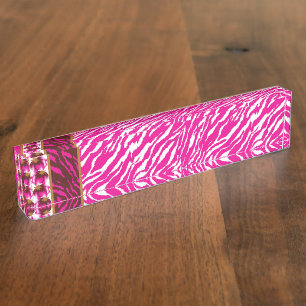 An intricate floral pattern in pink and white, art desk name plate