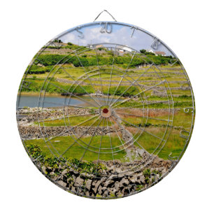 An Irish Stone Wall Dartboard With Darts