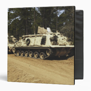 An M-88 recovery vehicle begins to tow an M992 3 Ring Binder