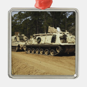 An M-88 recovery vehicle begins to tow an M992 Metal Ornament
