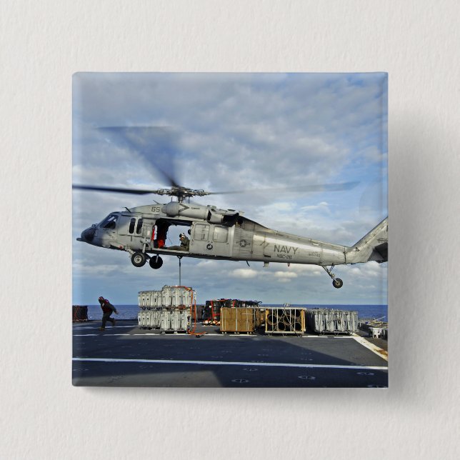 An MH-60S Seahawk prepares to deliver ammunitio Button (Front)