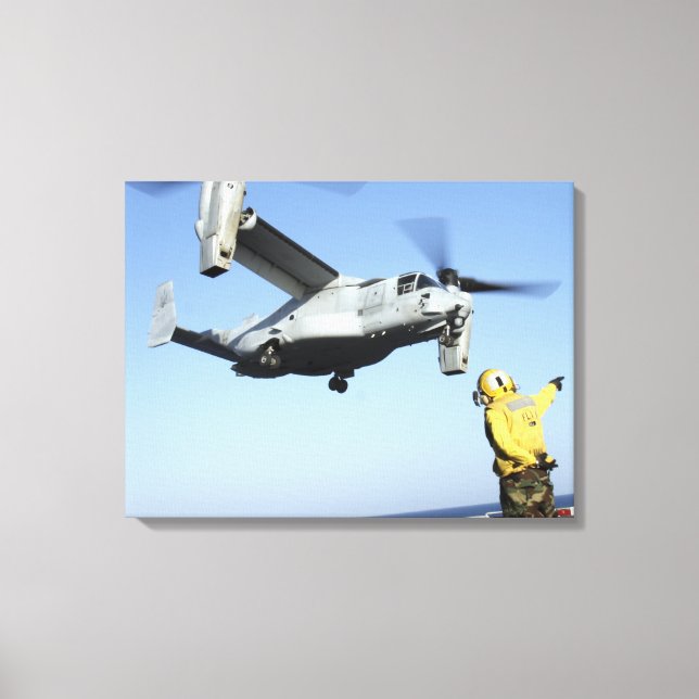An MV-22 Osprey launches from the USS Nassau Canvas Print (Front)