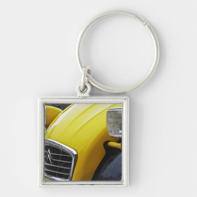 An old black and yellow Citroen 2CV 2 CV, detail Keychain (Front)