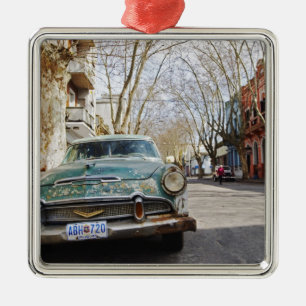 An old car rusty and flaky colour parked in the metal ornament