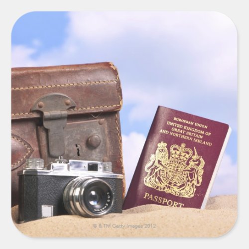 An old leather suitcase retro camera and square sticker