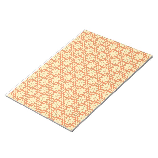 an orange and white background with a pattern notepad (Angled)