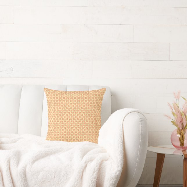an orange and white background with a pattern throw pillow (Couch)