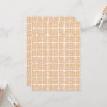 an orange and white wallpaper with a floral design invitation