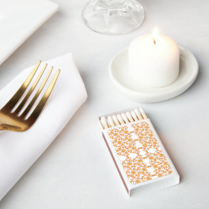 an orange and white wallpaper with a floral design matchboxes