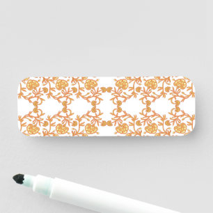 an orange and white wallpaper with a floral design name tag