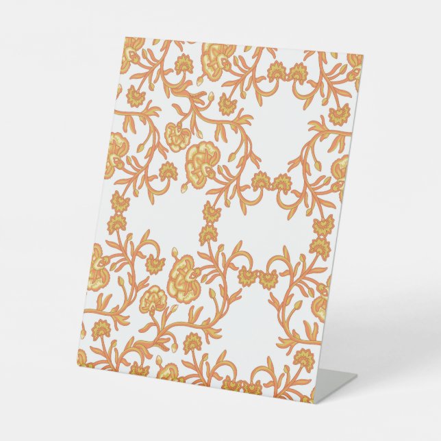 an orange and white wallpaper with a floral design pedestal sign (Front)