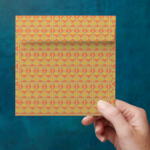 an orange and yellow background with a pattern envelope