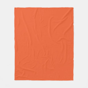 an orange background with a black border fleece blanket