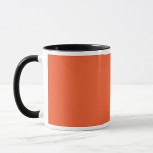 an orange background with a black border mug