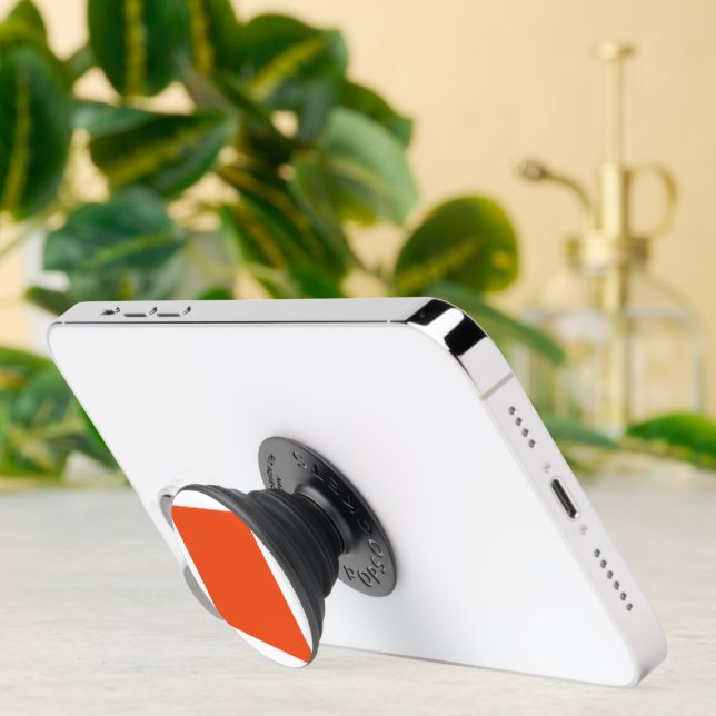 an orange background with a black border PopSocket (Insitu)