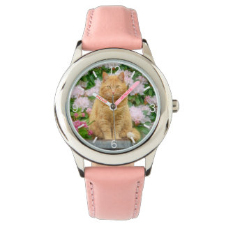 An Orange Cat in a Garden with Pink Spring Flowers Watch