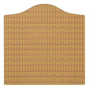 An orange, yellow, and brown symmetrical pattern w door sign