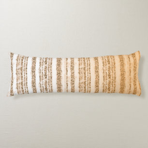 An ornate textile design featuring orange and whit body pillow