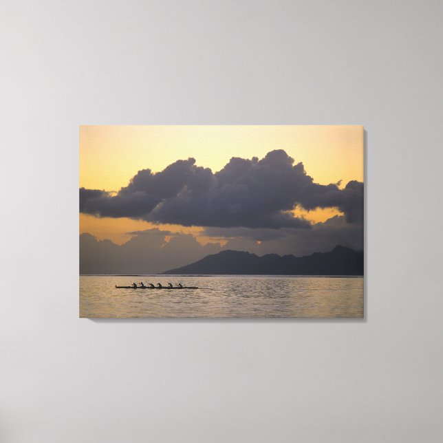 An outrigger canoe team practices off the coast canvas print (Front)